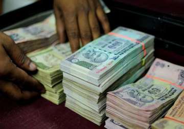 rupee falls 35 paise to 61.79 against dollar as stocks decline