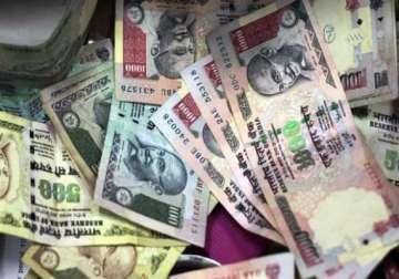 rupee sinks to 10 month low at rs 56.17 a dollar