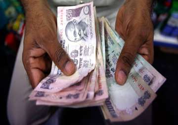 rupee up 29 paise to seven week high of 61.44 against dollar