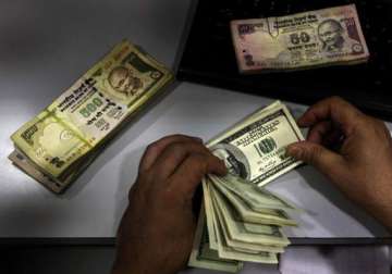 rupee drops 34 paise vs dollar in late morning trade