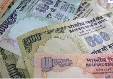 rupee down 7 paise at 52.02/03 vs dollar