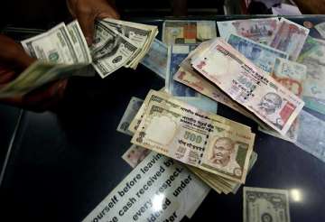 rupee gains 28 paise to 51.30/31 against dollar