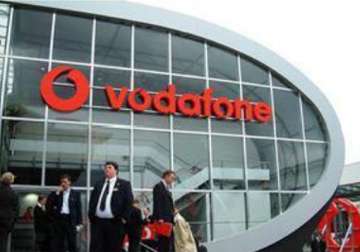 vodafone revenues down 7.7