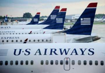 world s biggest airline emerges as us airways american airlines announce 11 billion merger