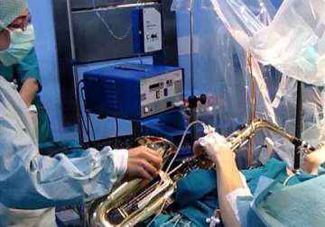 watch musician plays saxophone during his brain surgery