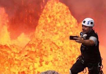 unbelievable see this man clicking selfie inside an active volcano