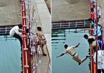 watch brave cop at kumbh mela jumps from 20 feet into river to save life