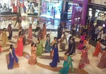 watch video women in flash mob show actresses how to dance wearing sarees