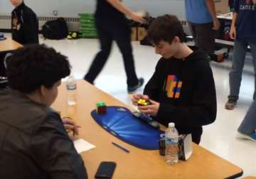 watch video kid sets world record by solving rubik s cube in 4.9 seconds