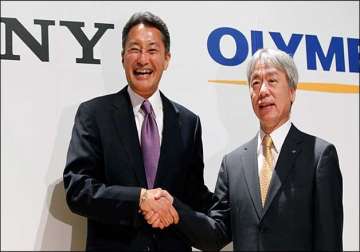 sony halves its stake with olympus