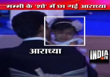 abhishek left holding the baby as aaradhya bawls after ash goes on stage