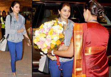 anushka sharma spotted at mumbai airport faces media with smile view pics