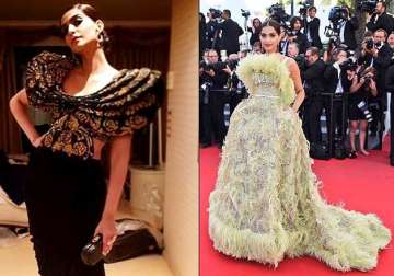 sonam kapoor turns up the heat in black disappoints in feather gown see pics