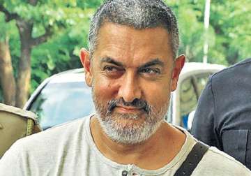 dangal s first look is out and aamir looks fiery in it