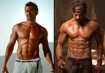 shah rukh khan in happy new year or hrithik roshan in bang bang who s abs are better view pics