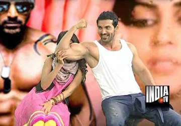 john abraham flexes his biceps in india tv studio