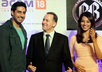 nz pm visits bollywood sets meets abhishek bipasha