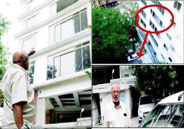 narrow escape for shyam benegal building glass panes crash on his car