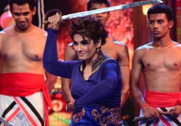 raveena tandon tries her hand at sword stunts