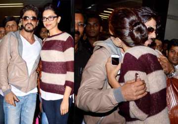 shah rukh deepika return from dubai concert spotted at mumbai airport view pics