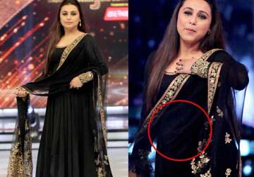 is that a baby bump rani mukerji caught keeping a safe cover over her belly