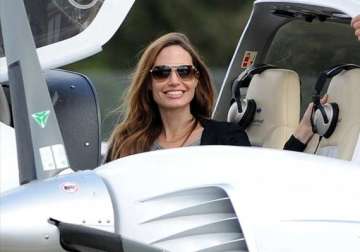 angelina jolie banned from flying private jet