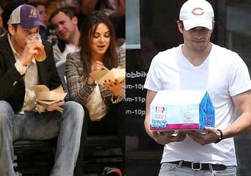 pregnancy cravings ashton kutcher stocks up ice cream for fiance mila kunis