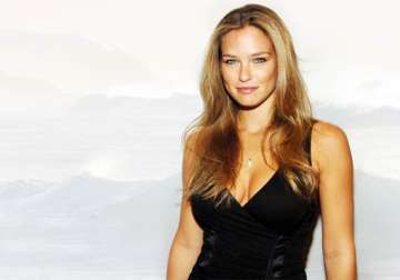 bar refaeli poses topless in war themed issue of magazine