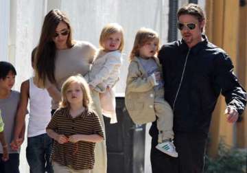 brad pitt delays 50th b day celebration