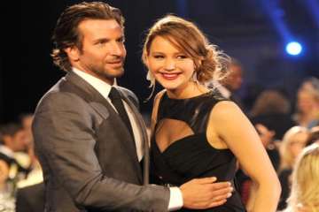 bradley cooper jennifer lawrence win big at mtv movie awards