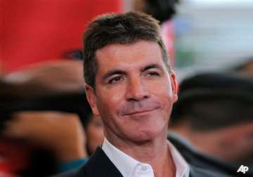 cowell talks voting by social media on x factor