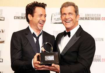 downey jr. asks hollywood to forgive mel gibson