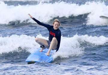 emma stone loves surfing see pics