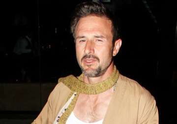 david arquette gets gold teeth flashes smile