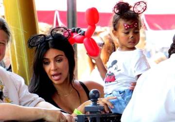 kim kardashian kanye west celebrate daughter s second b day at disneyland see pics