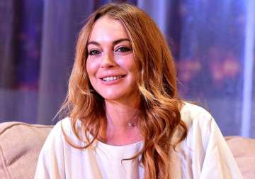 lindsay lohan finds new man keen to settle in britain