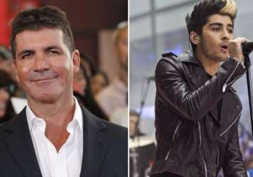 simon cowell slams zyan malik for his comment on one direction