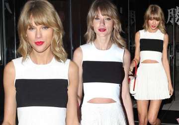 swift flaunts legs in tiny white skirt