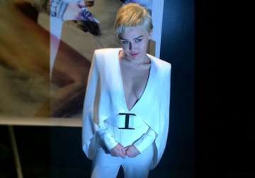 miley cyrus dons elvis presley s look