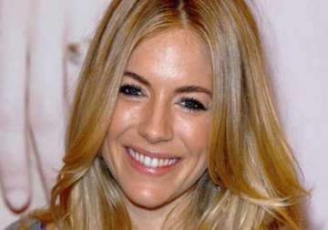 motherhood keeps sienna miller busy