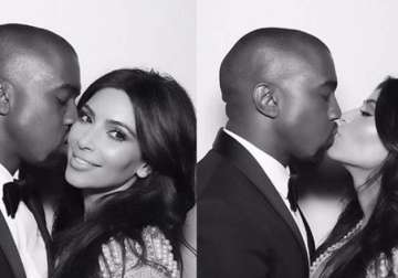 kim kardashian tweets kissing pics with husband kanye west on first wedding anniversary