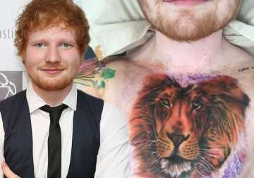 ed sheeran stands for his lion tattoo