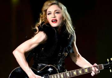 madonna furious over photo leak urges fans not to distribute her nude images