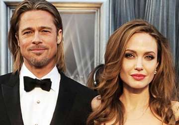 angelina jolie and brad pitt to adopt orphan from syria