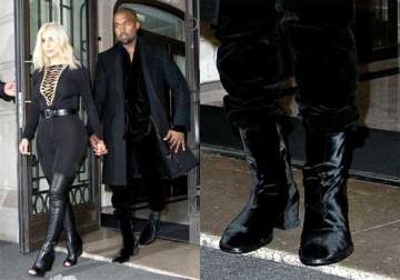 kanye sports heels at paris fashion week