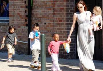angelina jolie trying to raise her kids as individuals