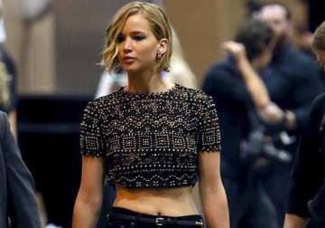 jennifer lawrence spotted backstage supporting chris martin