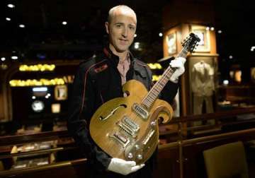 john lennon s guitar to be auctioned