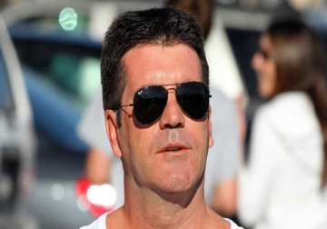is simon cowell going to be a dad