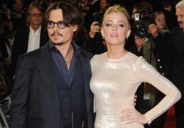 it s confirmed johnny depp is engaged to amber heard